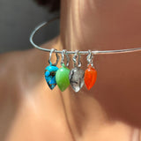 AMANDA PEARL recycled sterling silver wire choker with gemstone drop charms with turquoise, chrysoprase, rutilated quartz, and carnelian on a model's neck.