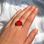AMANDA PEARL recycled sterling silver and carnelian cabochon ring on a model's hand.