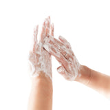 Hands with soap bubbles on a white background
