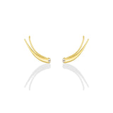 A pair of 14k recycled yellow gold climber earrings with a quill spike shape and a bezel set round pearl on a white background