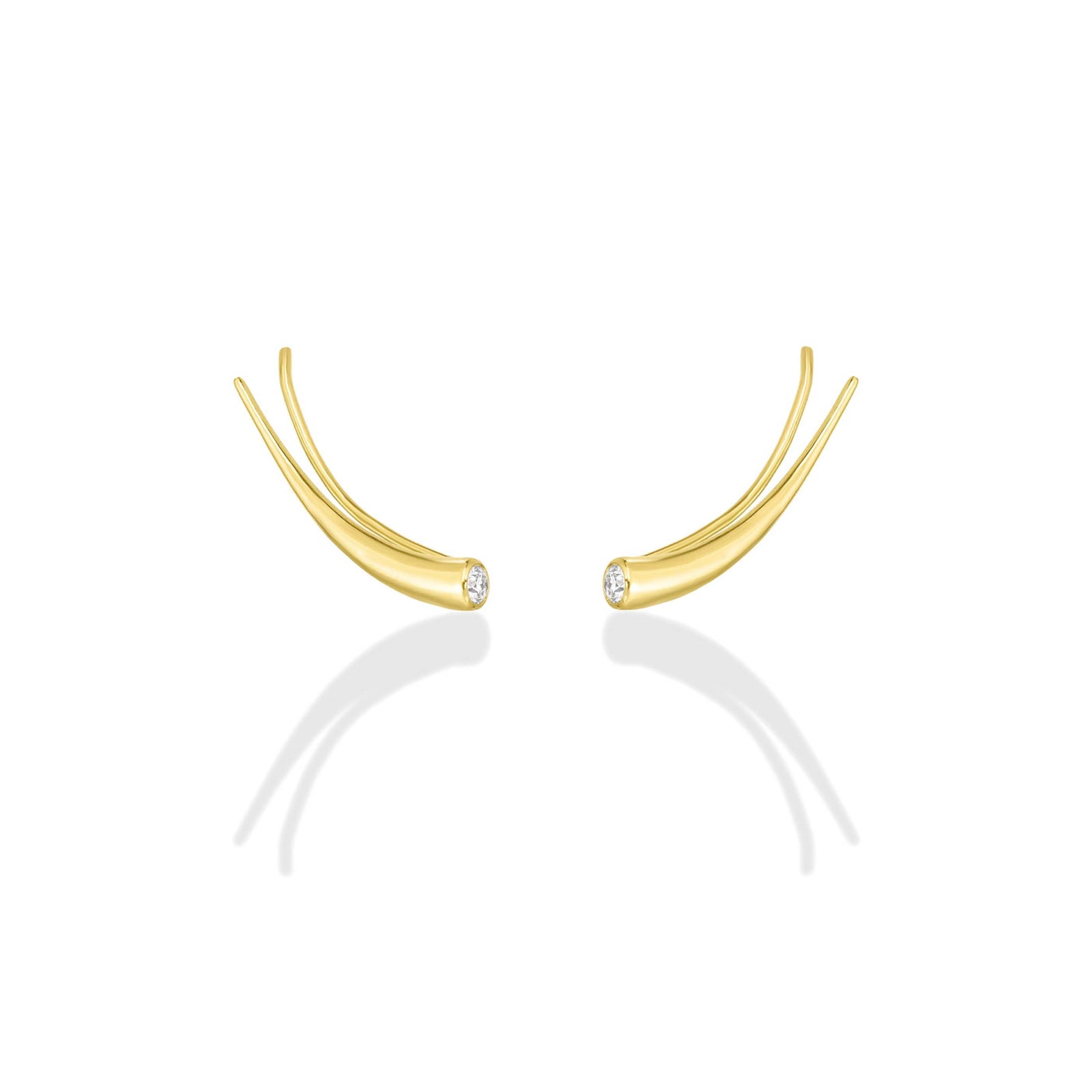 A pair of 14k recycled yellow gold climber earrings with a quill spike shape and a bezel set round diamond on a white background.