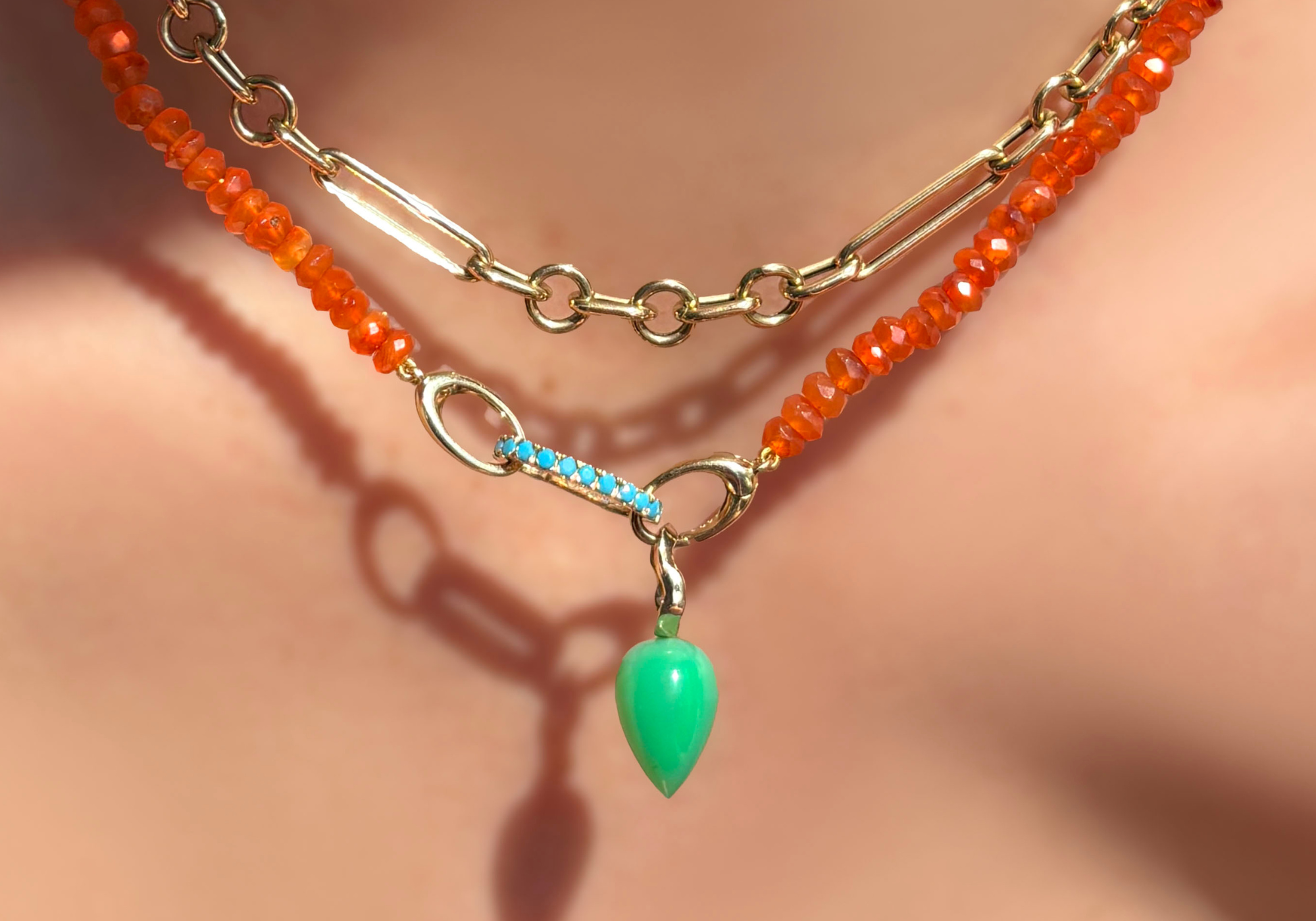 AMANDA PEARL carnelian faceted beaded necklace with a turquoise charm lock and chrysoprase drop charm with 14K recycled yellow gold ripple bale. This picture shows how you could style your evolution clasp.
