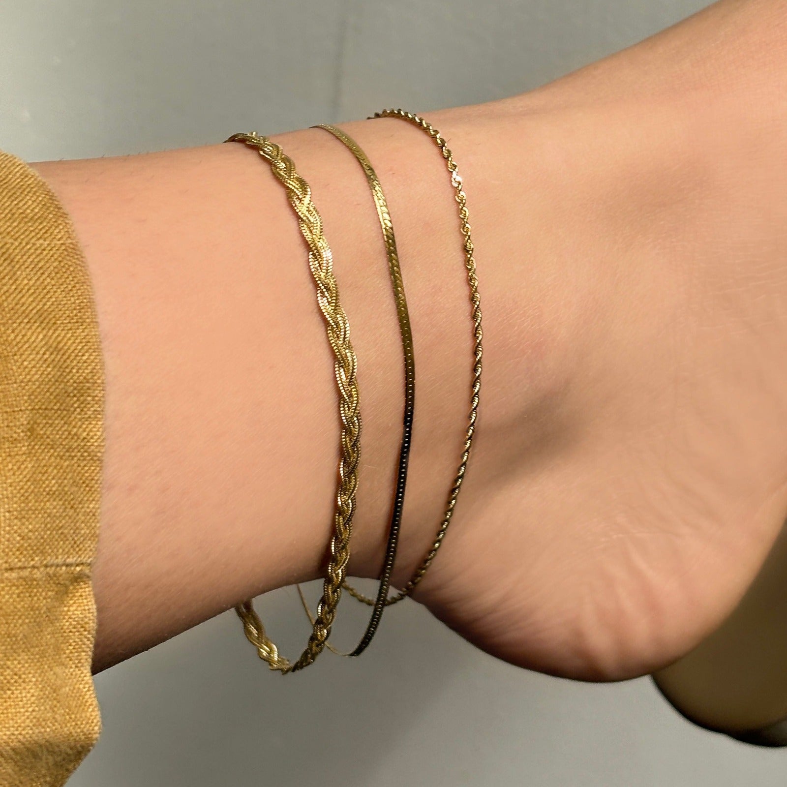 14k gold Braided Fox Chain Anklet styled on an ankled
