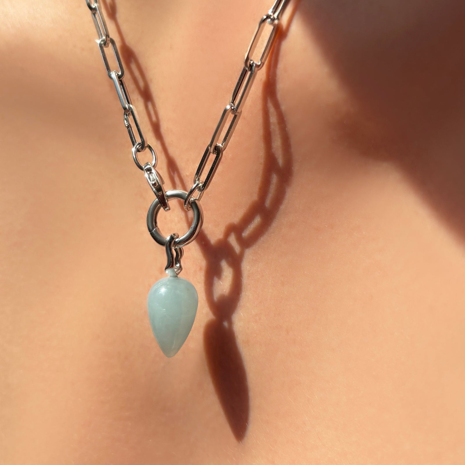 Aquamarine Drop charm on white gold chunky paperclip chain necklace with round charm lock.