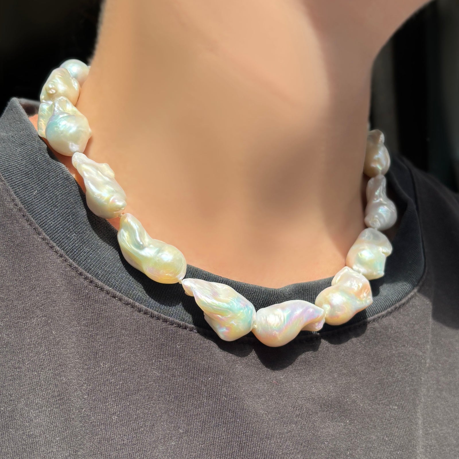 Baroque Pearl Collar on a model wearing a black tee.