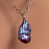 Irregular chain necklace with storm blue baroque pearl charm on a recycled 14k gold ripple bale.