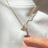Diamond cut bead chain with marquise molten solitaire charm on a white tee, sparkling in the sunshine.