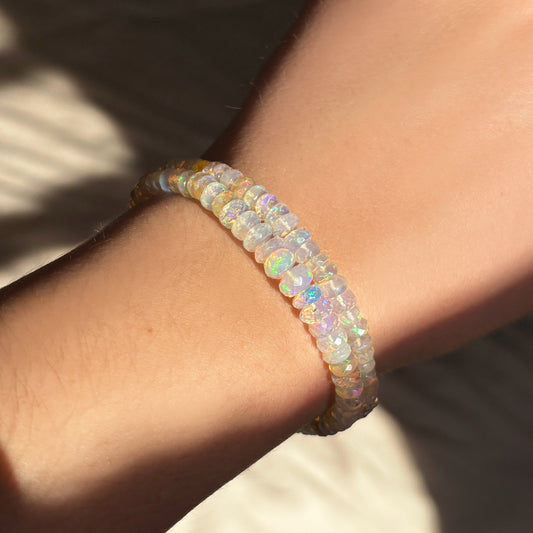 Flashy Faceted Opal Bracelet stacked together on a wrist