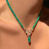 green faceted opal necklace  with medium pave face charm lock and malachite drop charm on a model's neck.