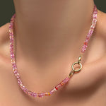 Hibiscus Sapphire Necklace with a 13mm plain round charm lock on a model's neck.