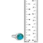 A recycled sterling silver ring with an oval turquoise cabochon gemstone, shown next to a black ruler with millimeter and inch markings to indicate its size.