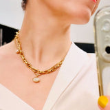 AMANDA PEARL recycled 14k gold molten solitaire charm with small oval ethical diamond on amanda.