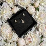 molten solitaire pear bundle on white peonies