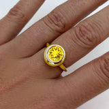 AMANDA PEARL recycled 14k gold Molten Solitaire Ring with citrine gemstone on a model's hand.