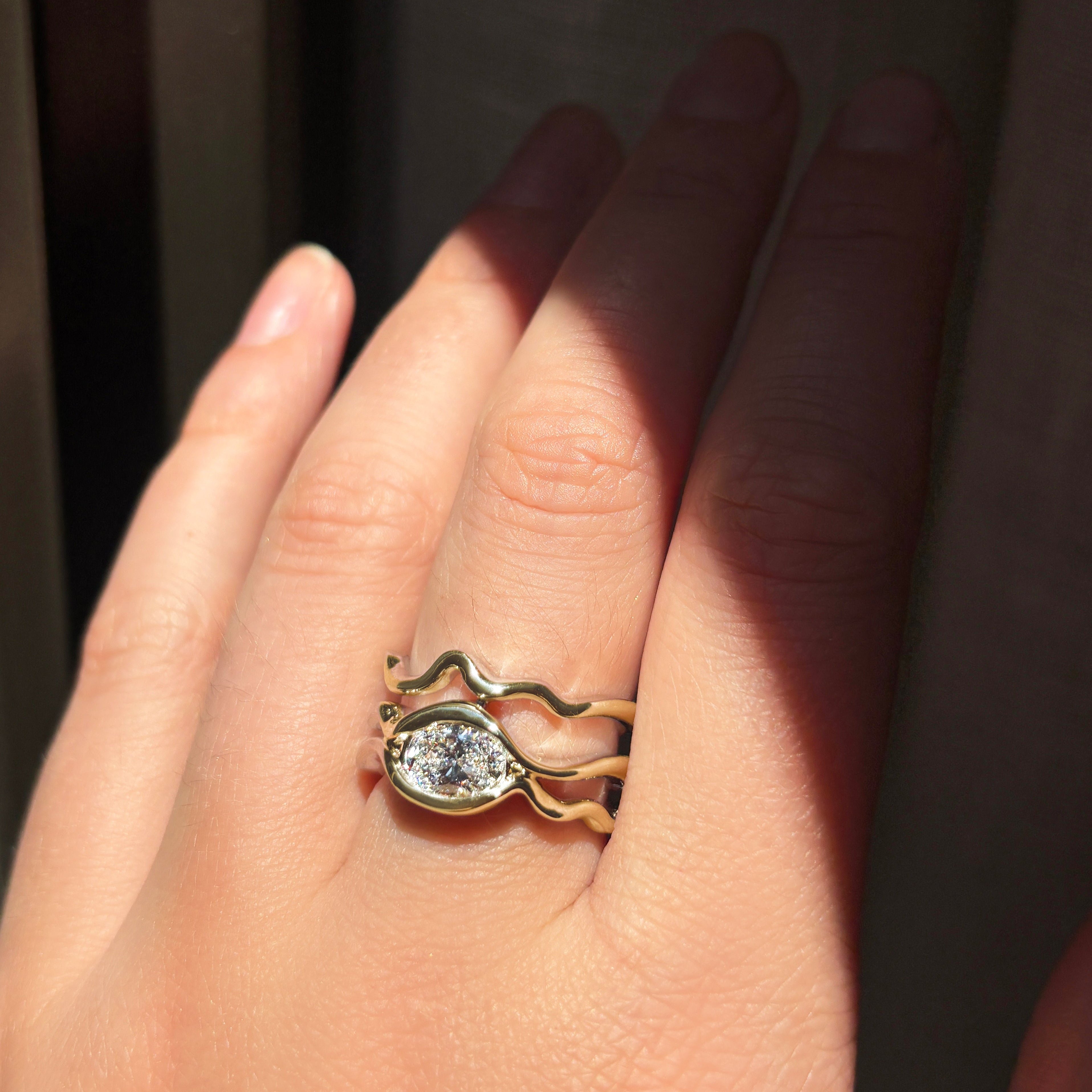 Multi Ripple Ring with Diamond in yellow gold worn on hand