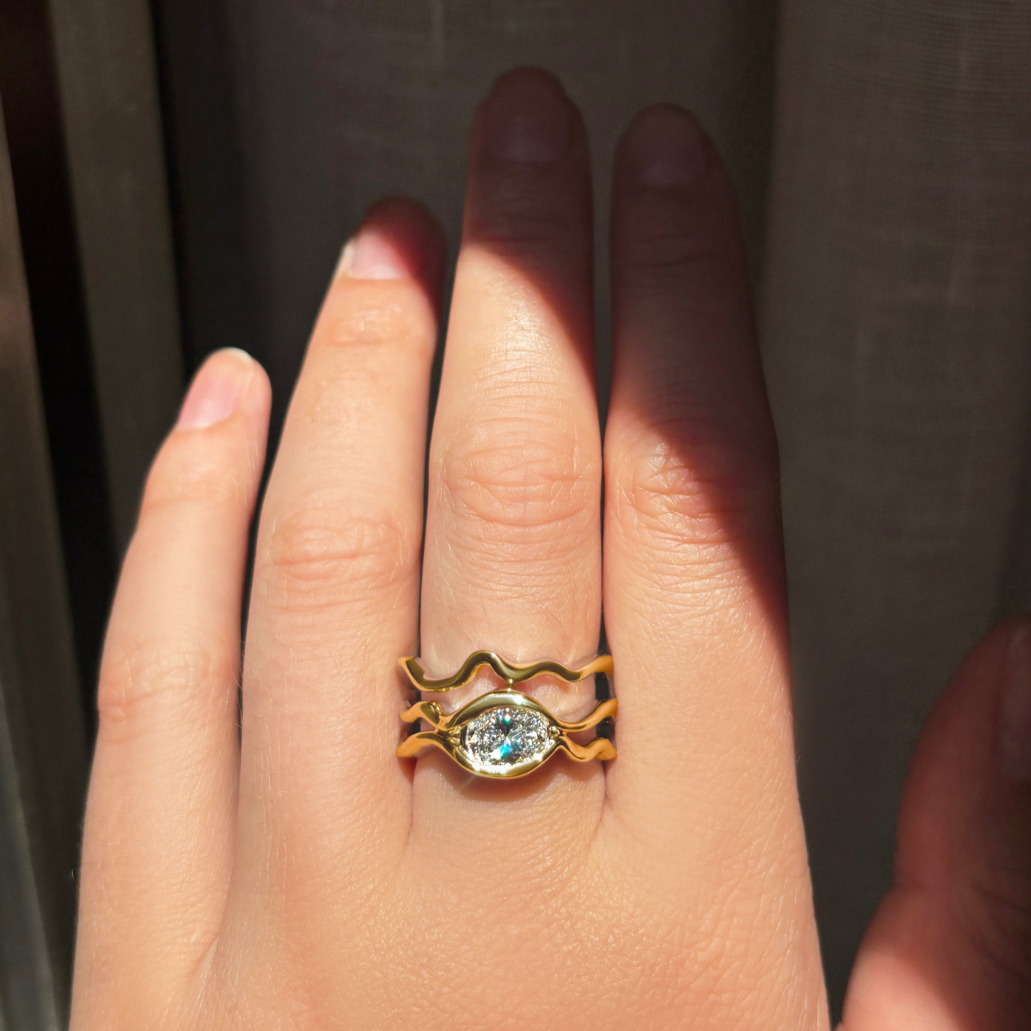 Multi Ripple Ring with Diamond in yellow gold worn on hand