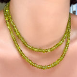2 strands of AMANDA PEARL Peridot Rondelles on a model's neck.