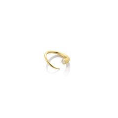 A 14K recycled yellow gold Quill Bypass Ring bezel set with a lab grown round white Diamond on a white background.  