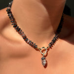 Rutilated Quartz on Neon Necklace with Round Pavé Face Charm Lock with Rutilated Quartz Drop Charm.