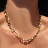 14k yellow gold drop link chain necklace with a safety pin charm lock and medium diamond pavé charm lock in the clasp.
