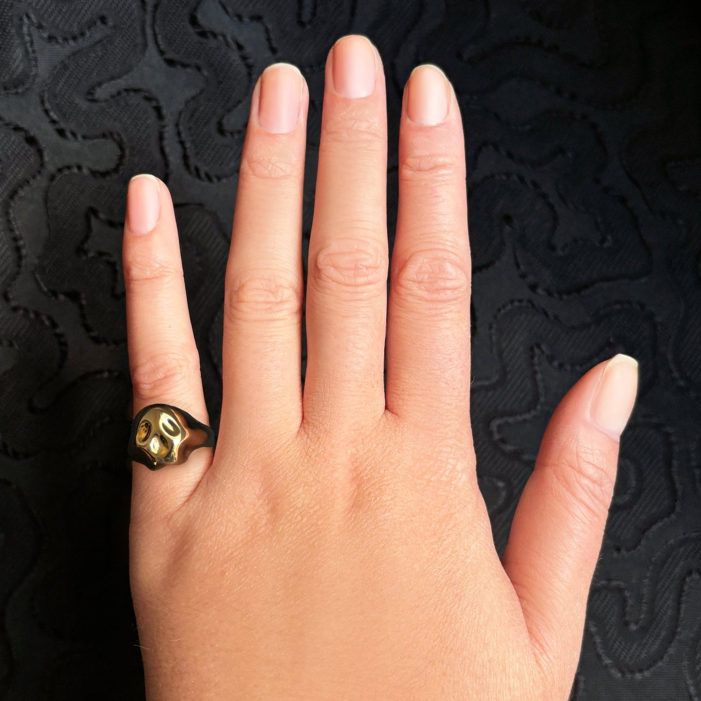 14K recycled Yellow Gold skull pinky ring styled on a hand