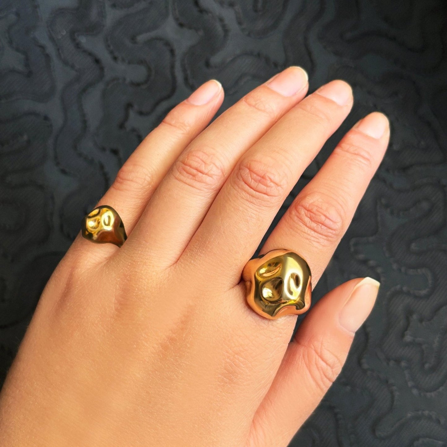 14K recycled Yellow Gold skull pinky ring styled on a hand, with the skull ring