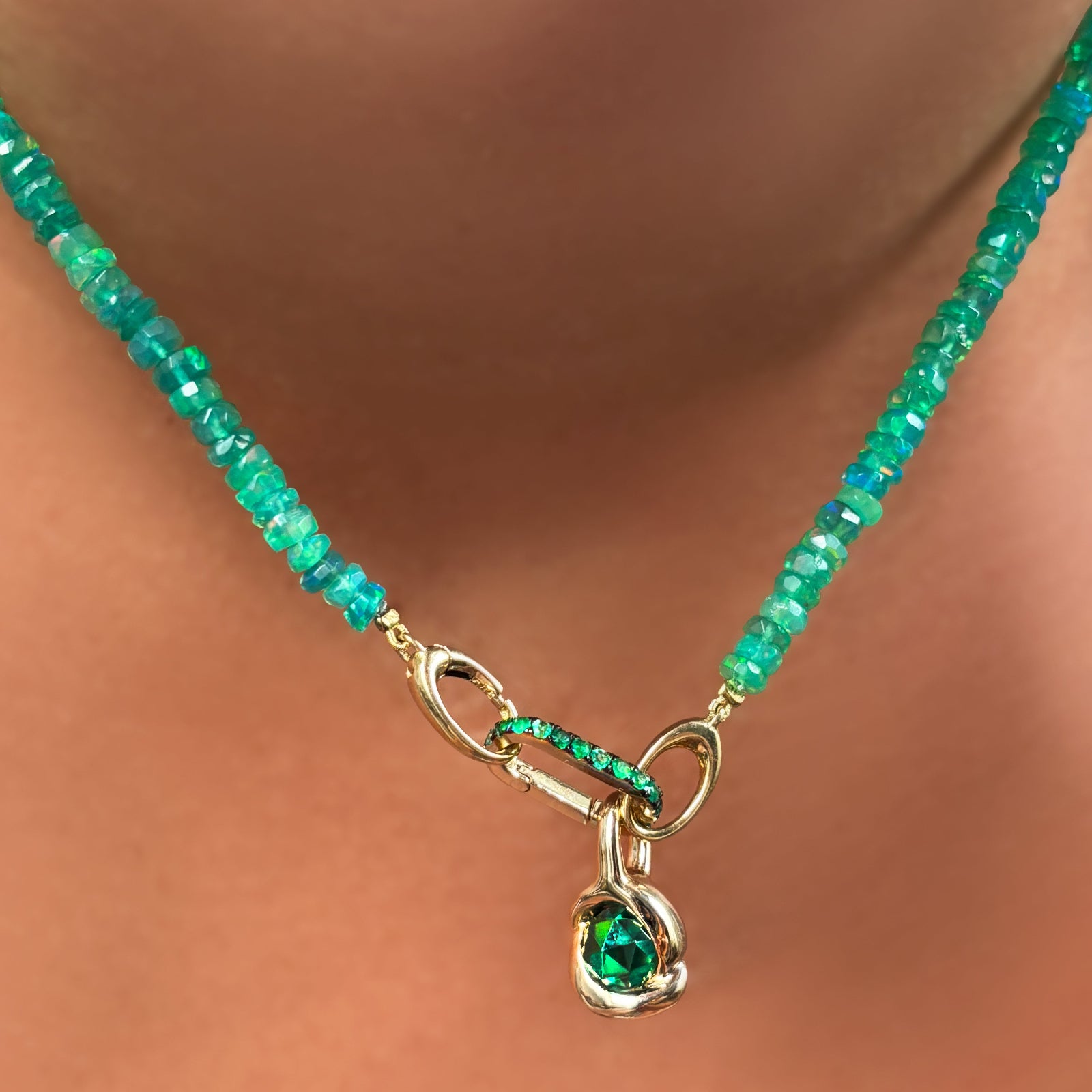 Small emerald charm lock paired with our molten knot charm and green faceted opal necklace