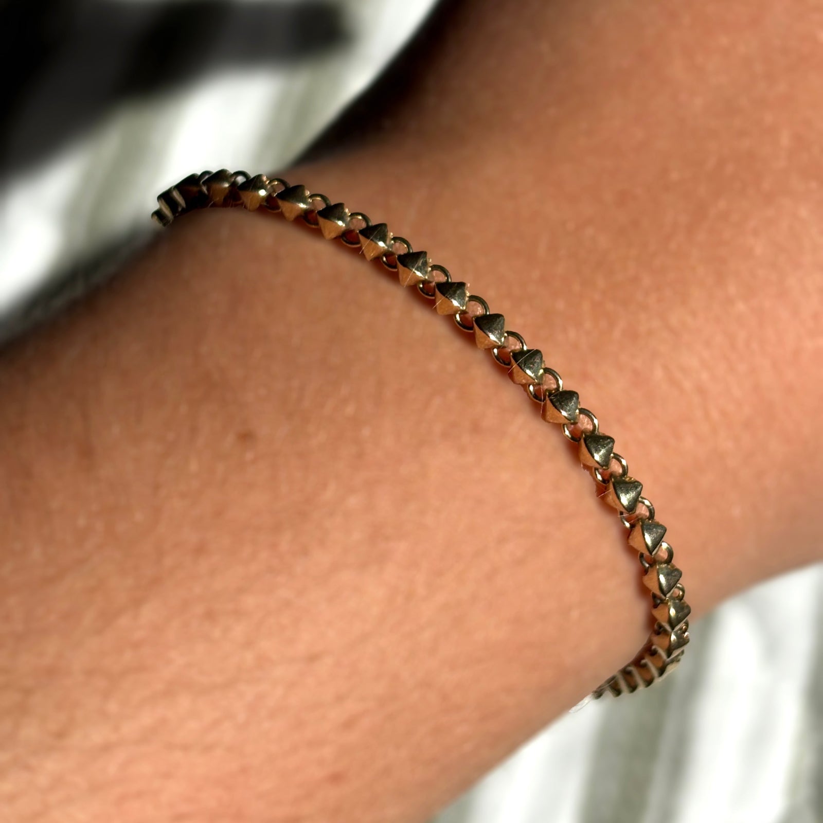 Tibet Chain Bracelet in 14k Yellow Gold on a model's wrist.