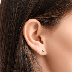 Close-up of an AMANDA PEARL Elements ethical diamond stud earring on a model's ear.