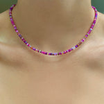 Shimmering Fuchsia Opal Necklace of smooth opals with various shades of pink, styled on a neck