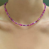 Shimmering Fuchsia Opal Necklace of smooth opals with various shades of pink, styled on a neck
